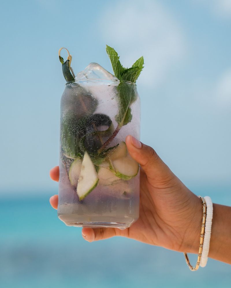 Blue Light Caribbean Gin cocktail with mint and cucumber