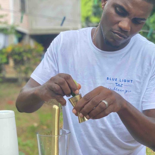 AJ with Blue Light Caribbean Gin