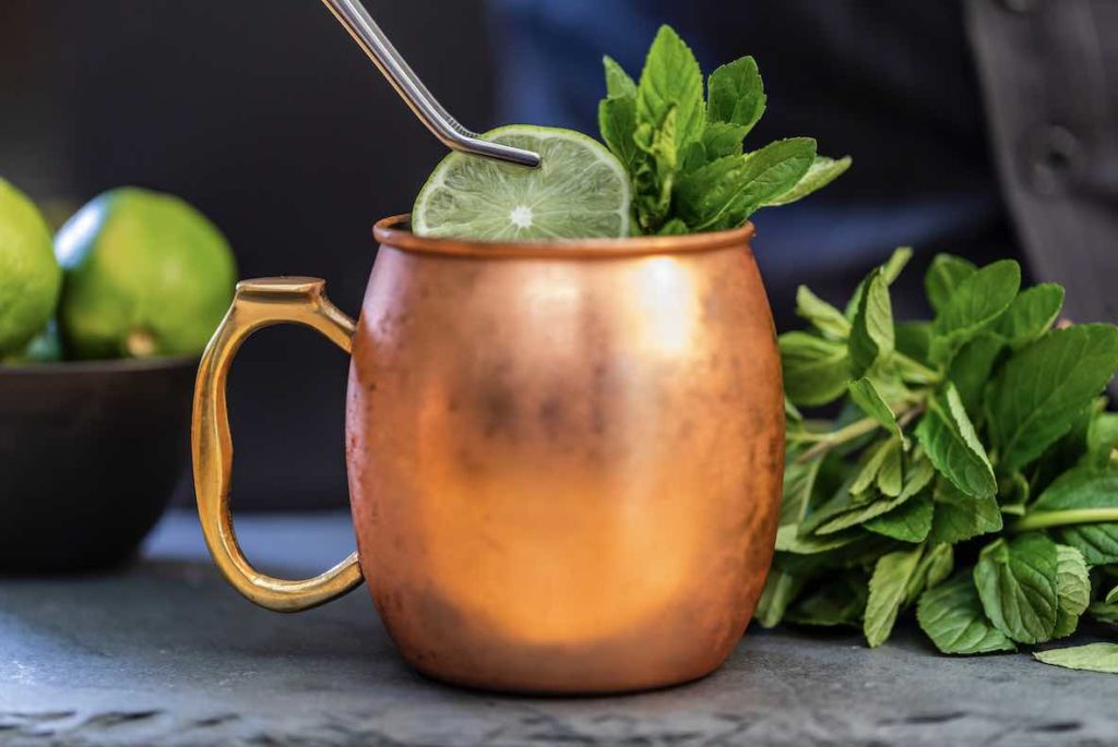 gin and tonic in copper mug